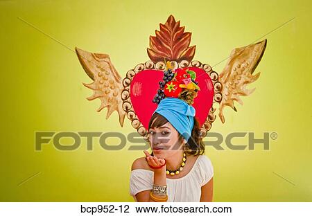 young woman wearing fruit hat View Large Photo Image Stock Image - young woman wearing fruit hat. Fotosearch