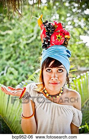 young woman wearing fruit hat View Large Photo Image Stock Photograph - young woman wearing fruit hat. Fotosearch