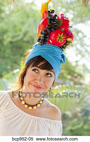 young woman wearing fruit hat View Large Photo Image Stock Photography - young woman wearing fruit hat. Fotosearch