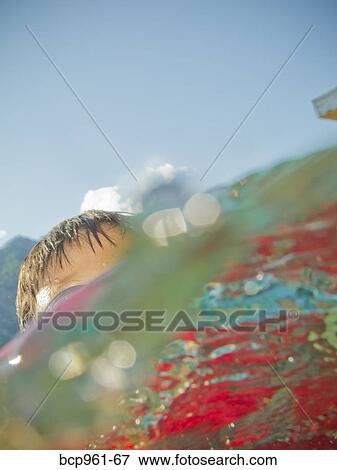 Stock Photo - Boy coming up out of water. Fotosearch