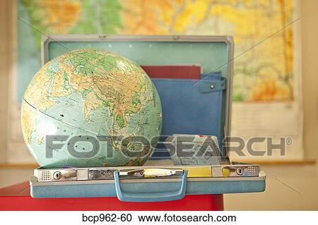 Globe sitting inside open vintage briefcase View Large Photo Image Stock Image - Globe sitting inside open vintage briefcase. Fotosearch