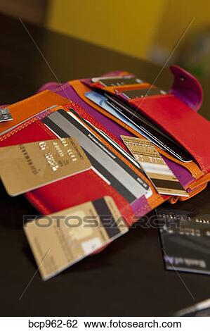 Open colorful wallet with cut up credit cards View Large Photo Image Stock Image - Open colorful wallet with cut up credit cards. Fotosearch