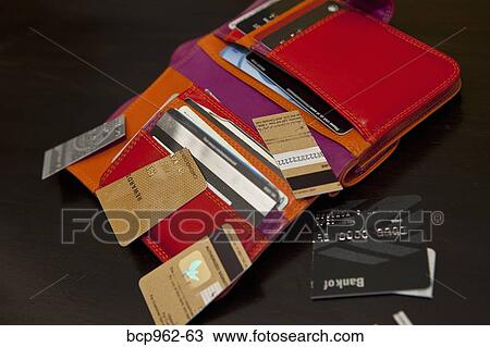 Open colorful wallet with cut up credit cards View Large Photo Image Stock Image - Open colorful wallet with cut up credit cards. Fotosearch
