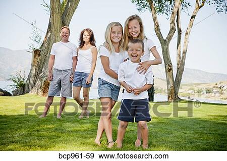 Outdoor portrait of family of five View Large Photo Image Stock Photo - Outdoor portrait of family of five. Fotosearch