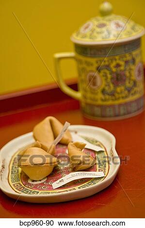 Plate of fortune cookies and tea mug View Large Photo Image Stock Image - Plate of fortune cookies and tea mug. Fotosearch