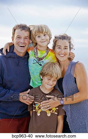 Stock Image - Portrait of man and woman with two boys. Fotosearch