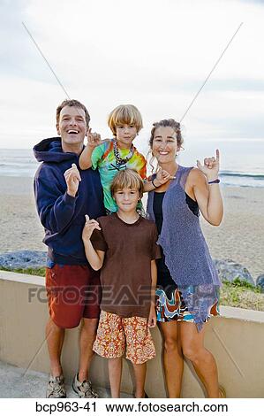 Stock Image - Portrait of man and woman with two boys. Fotosearch