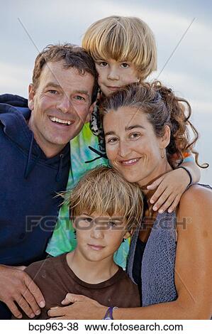 Portrait of man and woman with two boys View Large Photo Image Stock Photo - Portrait of man and woman with two boys. Fotosearch
