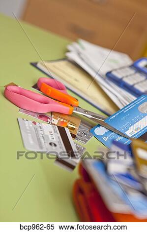 Scissors cutting up credit cards View Large Photo Image Stock Photography - Scissors cutting up credit cards. Fotosearch