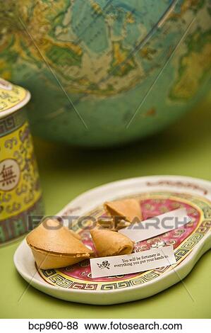 Still life with fortune cookies and globe View Large Photo Image Stock Photo - Still life with fortune cookies and globe. Fotosearch