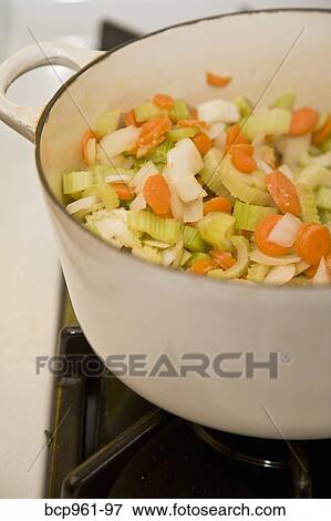 White pot with vegetables on stove View Large Photo Image Stock Photo - White pot with vegetables on stove. Fotosearch