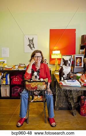 Woman at home office desk with dogs View Large Photo Image Stock Photo - Woman at home office desk with dogs. Fotosearch