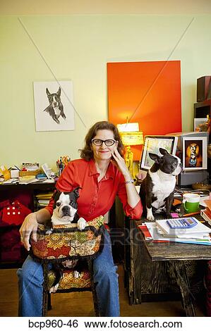 Woman at home office desk with dogs View Large Photo Image Stock Photograph - Woman at home office desk with dogs. Fotosearch