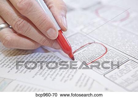 Woman circling employment ads in paper View Large Photo Image Stock Image - Woman circling employment ads in paper. Fotosearch