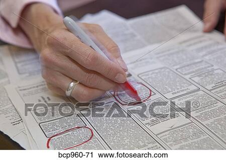 Woman circling employment ads in paper View Large Photo Image Stock Image - Woman circling employment ads in paper. Fotosearch