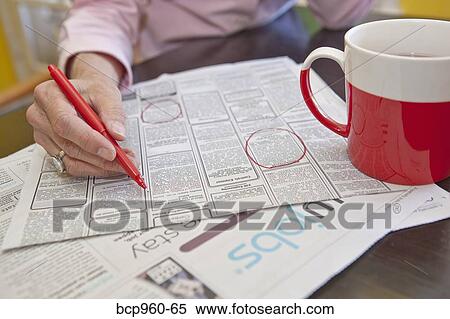 Woman circling employment ads in paper View Large Photo Image Stock Photography - Woman circling employment ads in paper. Fotosearch