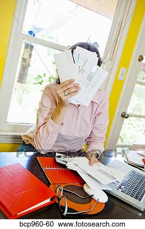 Woman paying bills View Large Photo Image Stock Image - Woman paying bills. Fotosearch