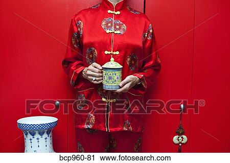 Woman wearing red silk Chinese pajamas View Large Photo Image Stock Image - Woman wearing red silk Chinese pajamas. Fotosearch