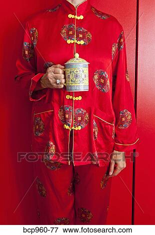 Woman wearing red silk Chinese pajamas View Large Photo Image Stock Photo - Woman wearing red silk Chinese pajamas. Fotosearch