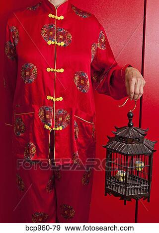 Woman wearing red silk Chinese pajamas View Large Photo Image Stock Photo - Woman wearing red silk Chinese pajamas. Fotosearch