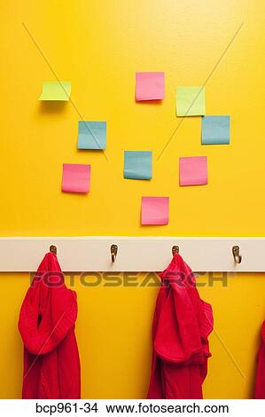 Picture - Yellow wall with colorful post-its. Fotosearch