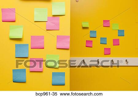 Stock Photography - Yellow wall with colorful post-its. Fotosearch