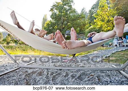 Children playing in hammock on beach View Large Photo Image Stock Photo - Children playing in hammock on beach. Fotosearch