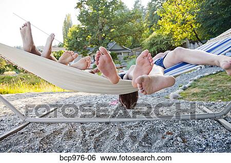 Children playing in hammock on beach View Large Photo Image Stock Photograph - Children playing in hammock on beach. Fotosearch
