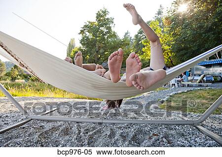 Children playing in hammock on beach View Large Photo Image Stock Photography - Children playing in hammock on beach. Fotosearch