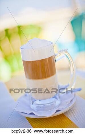 Stock Photograph - Colorful drink on seaside table. Fotosearch