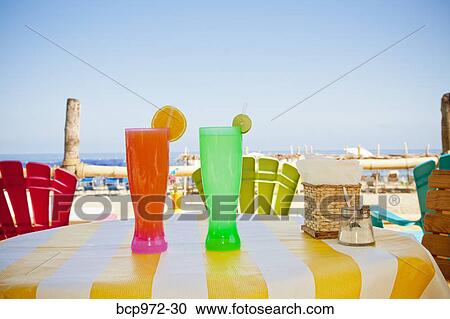 Colorful drinks on seaside table View Large Photo Image Stock Image - Colorful drinks on seaside table. Fotosearch