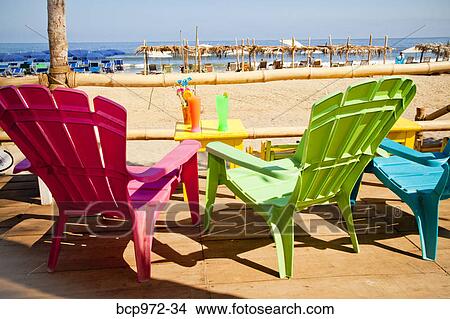 Colorful seaside table and chairs View Large Photo Image Picture - Colorful seaside table and chairs. Fotosearch
