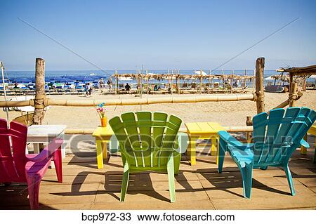 Colorful seaside table and chairs View Large Photo Image Stock Image - Colorful seaside table and chairs. Fotosearch
