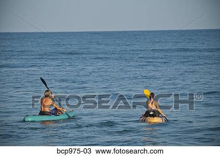 Couple kayaking in ocean View Large Photo Image Stock Image - Couple kayaking in ocean. Fotosearch