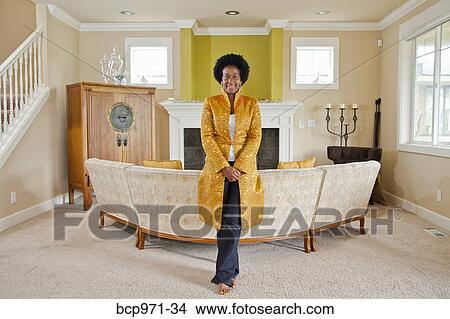 Elegant woman in formal living room View Large Photo Image Picture - Elegant woman in formal living room. Fotosearch
