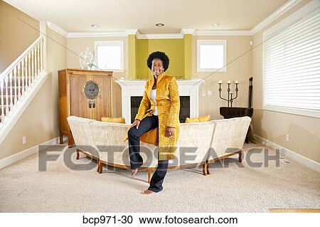 Elegant woman in formal living room View Large Photo Image Stock Image - Elegant woman in formal living room. Fotosearch
