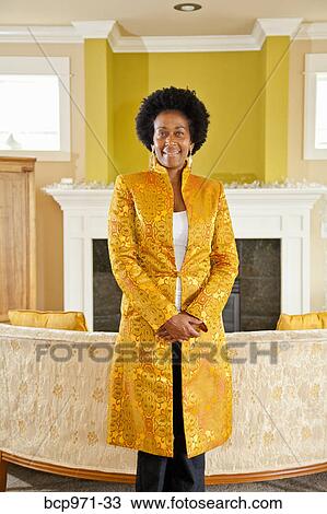 Elegant woman in formal living room View Large Photo Image Stock Image - Elegant woman in formal living room. Fotosearch