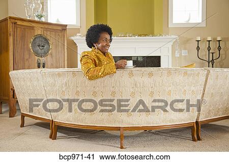 Elegant woman in formal living room View Large Photo Image Stock Image - Elegant woman in formal living room. Fotosearch