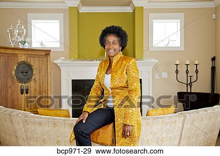 Elegant woman in formal living room View Large Photo Image Stock Photo - Elegant woman in formal living room. Fotosearch