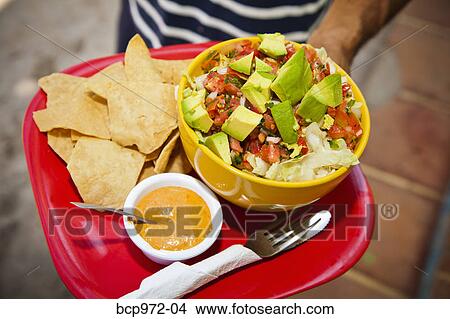 Hand holding serving of mexican food View Large Photo Image Picture - Hand holding serving of mexican food. Fotosearch
