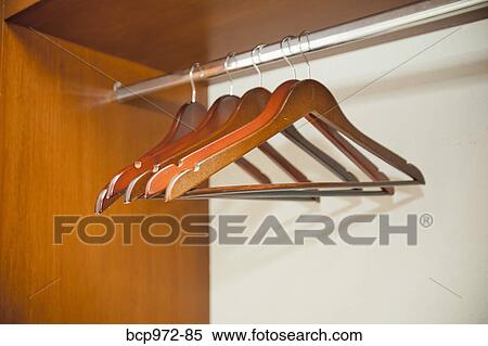 Hotel room closet with empty hangers View Large Photo Image Stock Photography - Hotel room closet with empty hangers. Fotosearch
