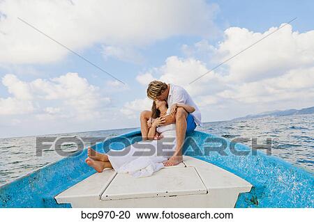 Man and woman embracing in bow of boat View Large Photo Image Stock Image - Man and woman embracing in bow of boat. Fotosearch