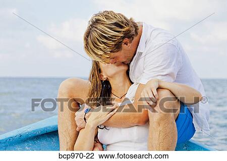 Man and woman embracing in bow of boat View Large Photo Image Stock Image - Man and woman embracing in bow of boat. Fotosearch