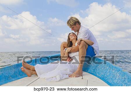 Man and woman embracing in bow of boat View Large Photo Image Stock Image - Man and woman embracing in bow of boat. Fotosearch