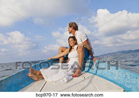 Man and woman embracing in bow of boat View Large Photo Image Stock Photo - Man and woman embracing in bow of boat. Fotosearch