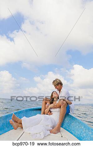 Man and woman embracing in bow of boat View Large Photo Image Stock Photo - Man and woman embracing in bow of boat. Fotosearch