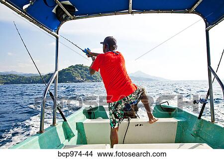 Man fishing on charter boat View Large Photo Image Picture - Man fishing on charter boat. Fotosearch