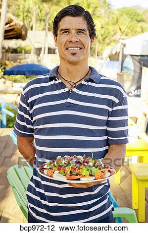 Man holding platter of mexican food View Large Photo Image Stock Image - Man holding platter of mexican food. Fotosearch