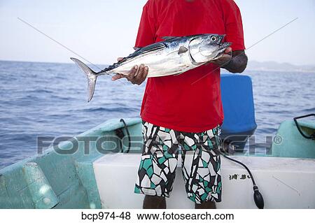 Man with fish on charter fishing boat View Large Photo Image Stock Photo - Man with fish on charter fishing boat. Fotosearch