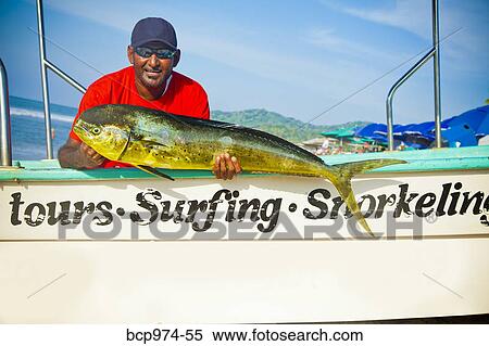 Man with fish on charter fishing boat View Large Photo Image Stock Photography - Man with fish on charter fishing boat. Fotosearch